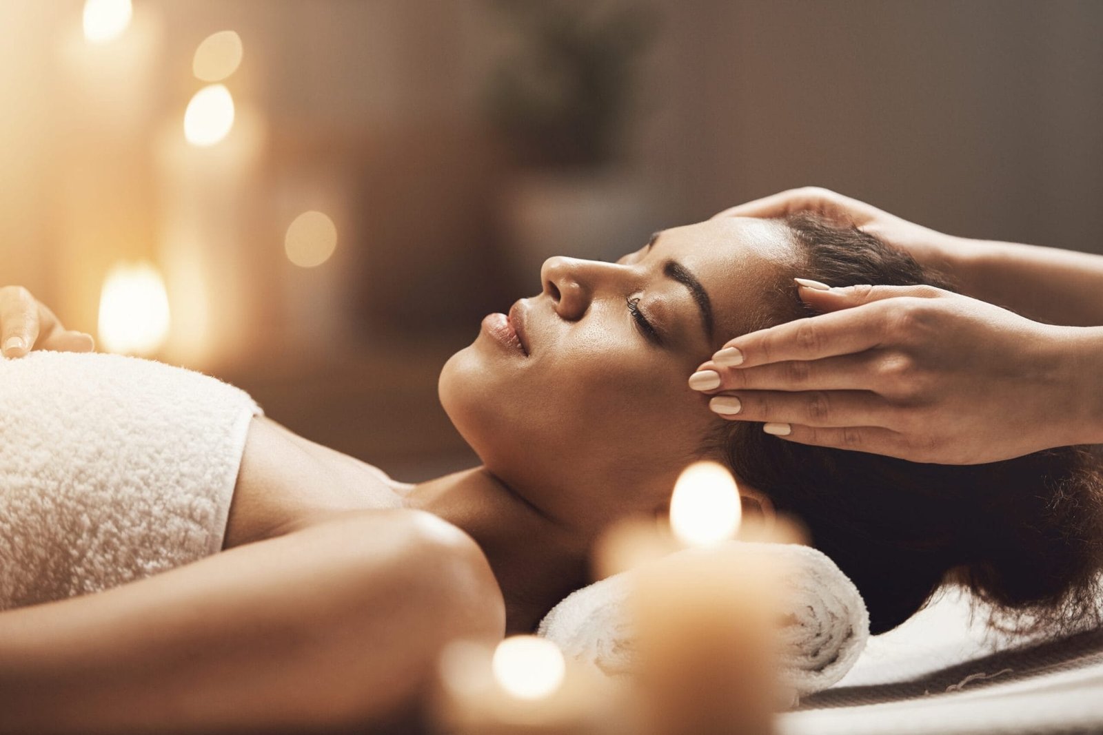 attractive african woman enjoying face massage spa salon scaled