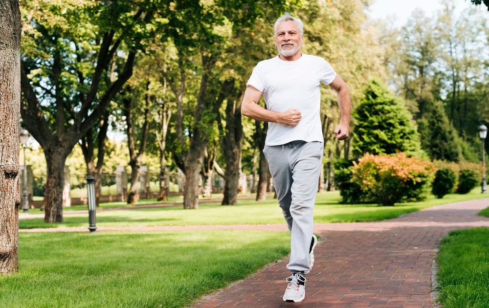full shot old man running outdoo